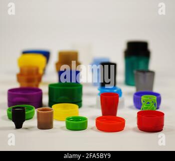 Recycling. Different shaped and colored caps from bottles, containers, creams and pastes. Stock Photo
