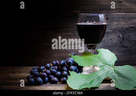 chalice with wine and grapes and sour bread, symbol of communion Stock Photo