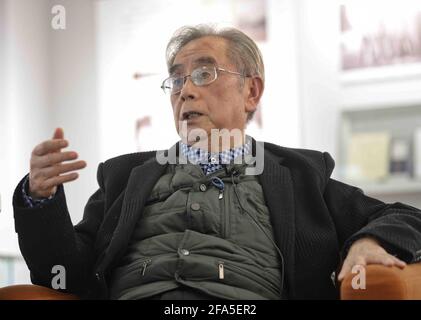 (210423) -- CHENGDU, April 23, 2021 (Xinhua) -- Yang Wuneng shares his experiences at an exhibition area dedicated to his translation achievements at Chongqing Library in southwest China's Chongqing Municipality, April 18, 2021.  In a career that spans over 60 years, Yang Wuneng has translated 31 German classics into the Chinese language, including 'Faust', 'Selected Poems of Heinrich Heine' and 'Immensee.' Many of his translations are still bestselling books in some bookstores. His translation of 'Grimms' Fairy Tales,' for instance, has been popular among Chinese readers for many generations. Stock Photo