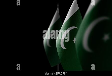 Small national flags of the Pakistan on a black background Stock Photo