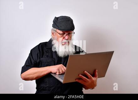 Senior man working on his laptop Stock Photo