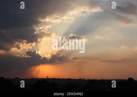 Sun rays at dusk, over the horizon Stock Photo