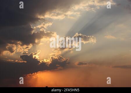 Sun rays at dusk, over the horizon Stock Photo