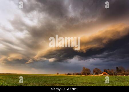 Storm Clouds in sunset light, dramatic storm clouds Stock Photo