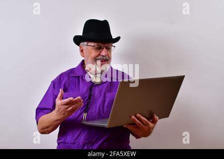 Cheerful senior American man using his laptop Stock Photo