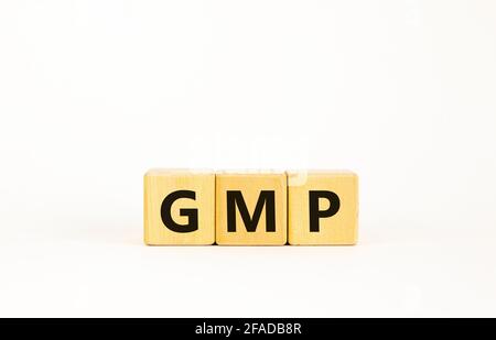 GMP, good manufacturing practice symbol. Concept words 'GMP, good manufacturing practice' on cubes on a beautiful white background. Business and GMP, Stock Photo