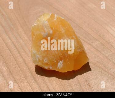 A large piece of raw golden Calcite stone Stock Photo