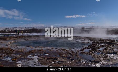 View of steaming water pool of famous geyser Strokkur (Icelandic 'churn') located in Geysir in geothermal area Haukadalur, Golden Circle, Iceland. Stock Photo