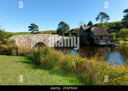 View of the Stone Bridge and Mill, on the Hobbiton Movie Set, Matamata, Waikato, New Zealand Stock Photo
