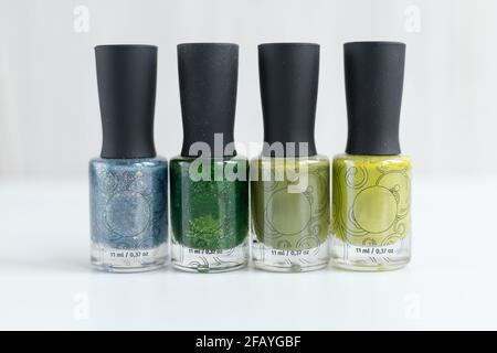 Collection of multi-colored bottles of nail polish. Layout for design on a gray background. Stock Photo