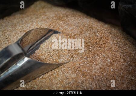 Ladle with of barley malt for beer, pale ale, pilsen. Stock Photo