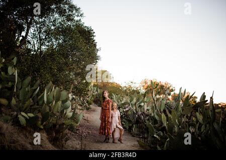 Sisters Posing in Desert Garden in San Diego Stock Photo