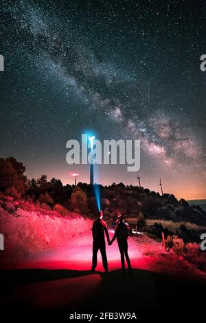 A loving couple observes the Milky Way Stock Photo