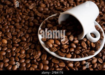 Cup and coffee bean at the black background Stock Photo