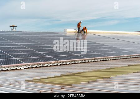 Unrecognizable solar panel technicians working on a Spanish factory Stock Photo