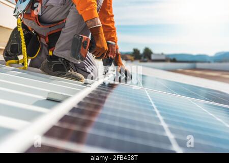 Unrecognizable solar panel technician working in Spanish installation Stock Photo
