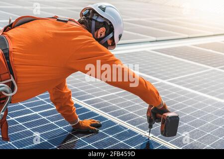 Unrecognizable solar panel technician working in Spanish installation Stock Photo