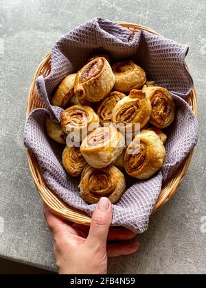 hand holds a basket of buns Stock Photo