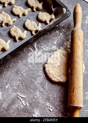 the rolling pin lies on the cookie dough Stock Photo