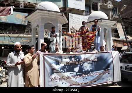 Members of Gandhara Hindko Board participate in rally to pay tribute to the score of people, who were killed 78 years ago by the firing of British Troops in Qissa Khawani Bazar Tragedy on 23rd April 1930, at Qissa Khawani Bazar in Peshawar on Friday, April 23, 2021. Stock Photo