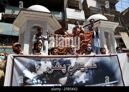 Members of Gandhara Hindko Board participate in rally to pay tribute to the score of people, who were killed 78 years ago by the firing of British Troops in Qissa Khawani Bazar Tragedy on 23rd April 1930, at Qissa Khawani Bazar in Peshawar on Friday, April 23, 2021. Stock Photo