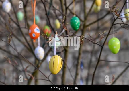 Colourful Easter eggs hanging on a tree close up Stock Photo
