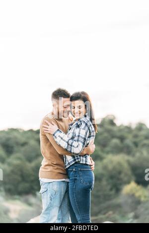 Smiling mid adult couple embracing each other Stock Photo