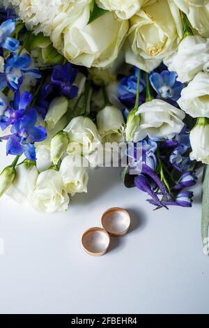 Wedding theme, beautiful wedding rings, bridal bouquet Stock Photo