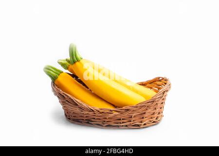 Summer Squash Zucchini Is Yellow Colored Gourd Also Known As Courgette, Baby Marrow, Indian Jugni Sabzi Or Jugnu Petha Sabji In Basket. Isolated On Wh Stock Photo