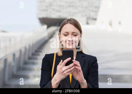 Female entrepreneur using smart phone Stock Photo