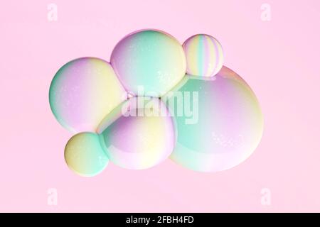 Yellow, green and pink pastel bubbles against pink background Stock Photo