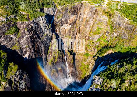 Scenic view of rainbow over Voringfossen waterfall Stock Photo