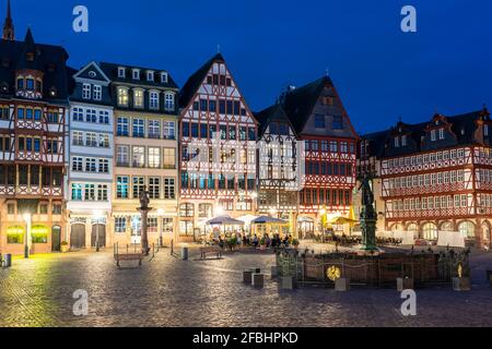 Germany, Hesse, Frankfurt, Illuminated Romerberg square at night with half-timbered townhouses in background Stock Photo