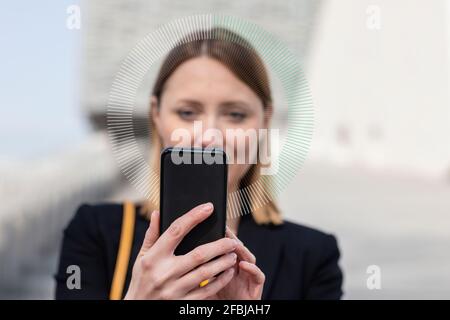 Entrepreneur using mobile phone outdoors Stock Photo