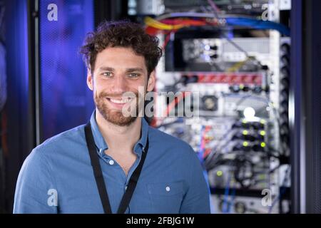 Smiling male IT expertise in data center Stock Photo