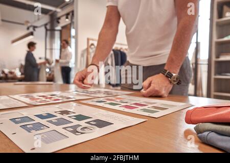 Fashion designer working in clothing design studio Stock Photo