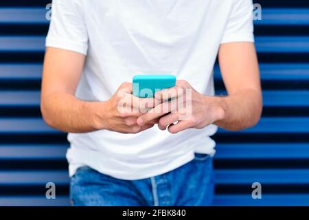 Young man using smart phone Stock Photo