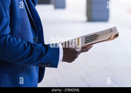 Male entrepreneur holding paper document Stock Photo