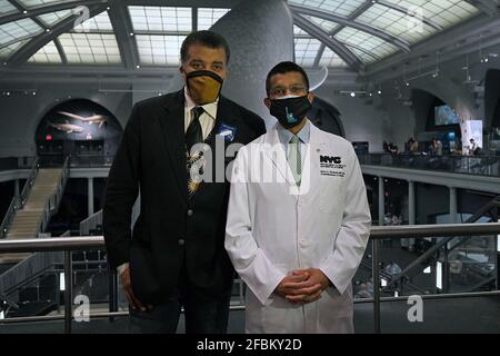 New York, USA. 23rd Apr, 2021. Dr. Neil deGrasse Tyson, director of the Hayden Planetarium and Dr. Dave Chokshi, New York City Commissioner of the Department of Health and Mental Hygiene pose together before attending a press conference for the opening of the COVID-19 vaccination site inside the American Museum of Natural History, New York, NY, April 23, 2021. More than 1/2 of the United States population has received at least one dose of vaccine. (Photo by Anthony Behar/Sipa USA) Credit: Sipa USA/Alamy Live News Stock Photo