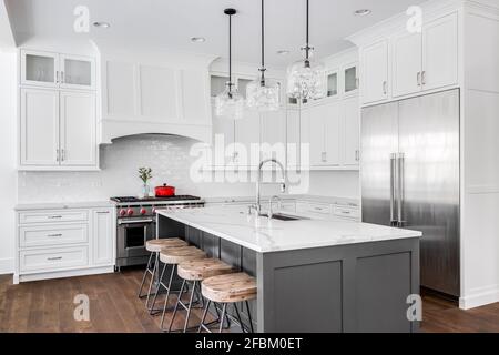 New Grey And White Kitchen With Appliances And Timber Bench Top Stock Photo Alamy