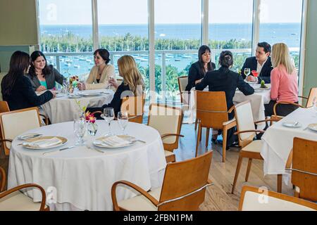 Miami Florida,Coconut Grove Sonesta hotel Panorama restaurant,Biscayne Bay view dining tables, Stock Photo