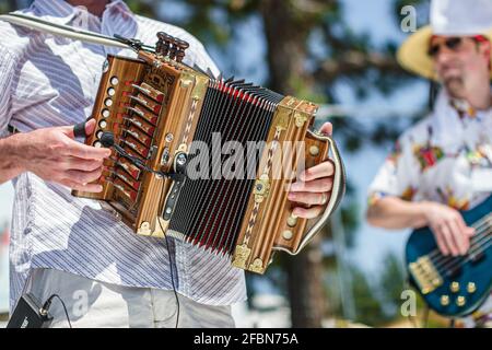 Deerfield Beach Florida Quiet Waters Park Zydeco Festival,Cajun music accordion bellows musician playing squeezebox, Stock Photo