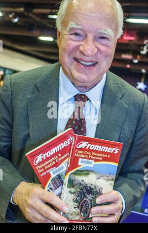 Orlando Florida,Central Avenue Public Library,guest speaker event holding travel guide books publisher Arthur Frommer, Stock Photo