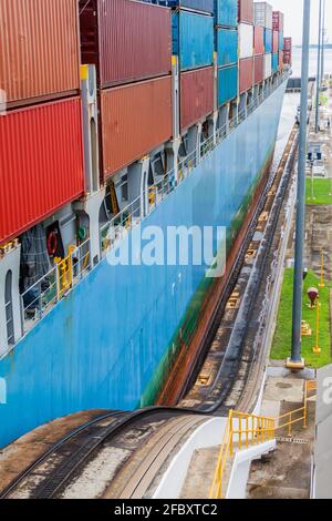 Container ship is  passing through Gatun Locks, part of Panama Canal Stock Photo