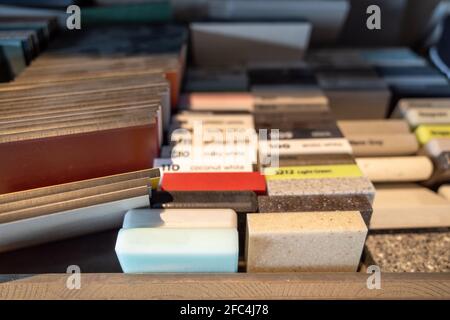 Selective focus view, stack group and heap of stone, granite marble tile samples. Example of building materials. Stock Photo