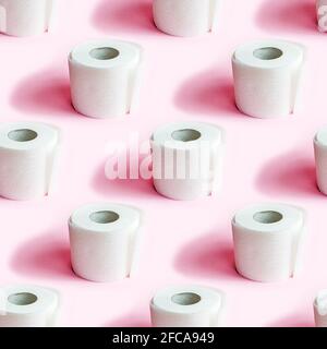 White toilet paper roll repeat seamless pattern on light pink background. Stock Photo