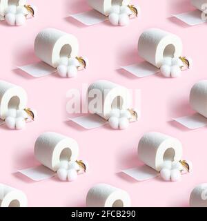 White toilet paper roll repeat seamless pattern on light pink background. Stock Photo