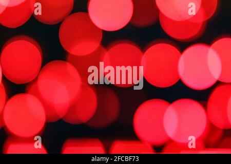 Red light from unfocused Christmas lights Stock Photo