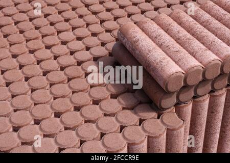 Garden Palisade Border Curb in store on palet. Decorate Palisade Lawn Edge Plant Border Concrete Cylinders for Path Garden architecture Stock Photo