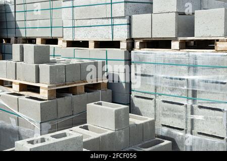 Stack of cement concrete Building cinder blocks brick  on pallete in hardware store Stock Photo